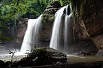 Medium sized waterfall in a tropical forest.