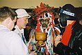 Twelft Night performers drinking from a wassail bowl.