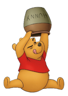 A yellow cartoon teddy bear with a red shirt, holding up an empty honey pot with his tongue sticking out.