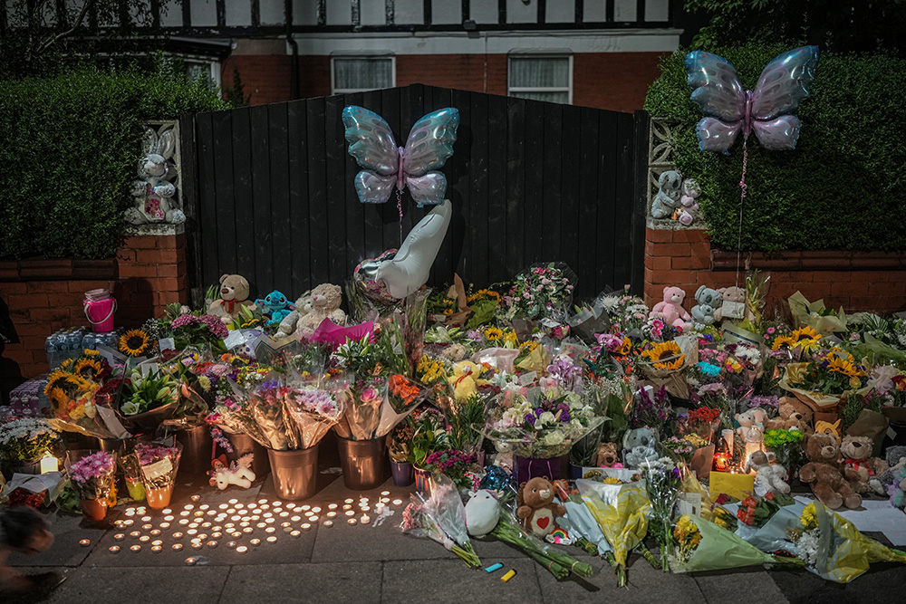 SOUTHPORT, ENGLAND - JULY 30: Tributes and candles to the victims of the Southport knife attack continue to be laid near the scene on July 30, 2024 in Southport, England. A teenager armed with a knife attacked children at a Taylor Swift-themed holiday club in Hart Lane, Southport yesterday morning. Three children have died and five children and two adults remain in a critical condition in hospital. A 17-year-old boy has been arrested.  (Photo by Christopher Furlong/Getty Images)