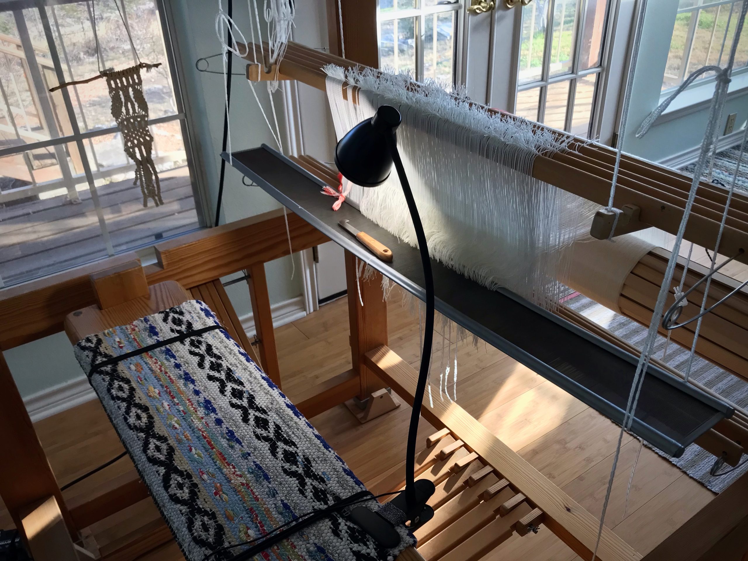 Clip-on lamp for detail work at the loom.