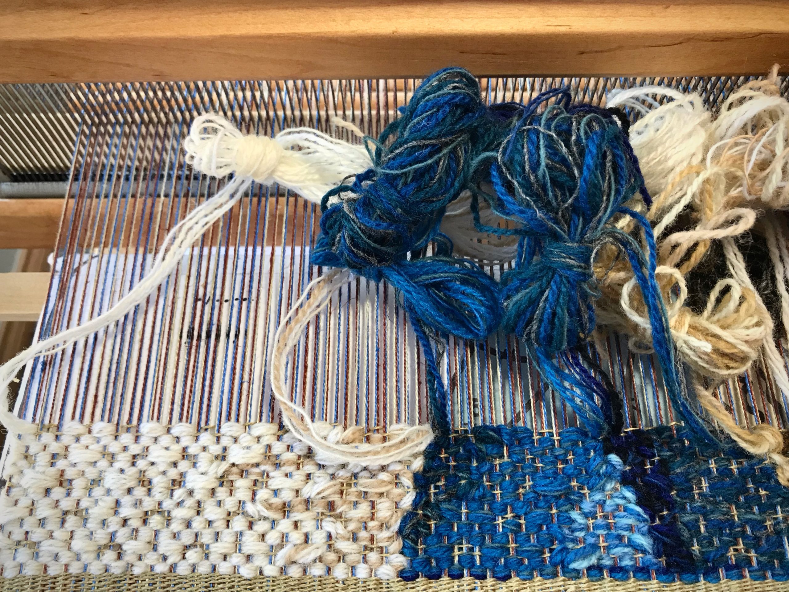 Wool butterflies for a tapestry portrait.