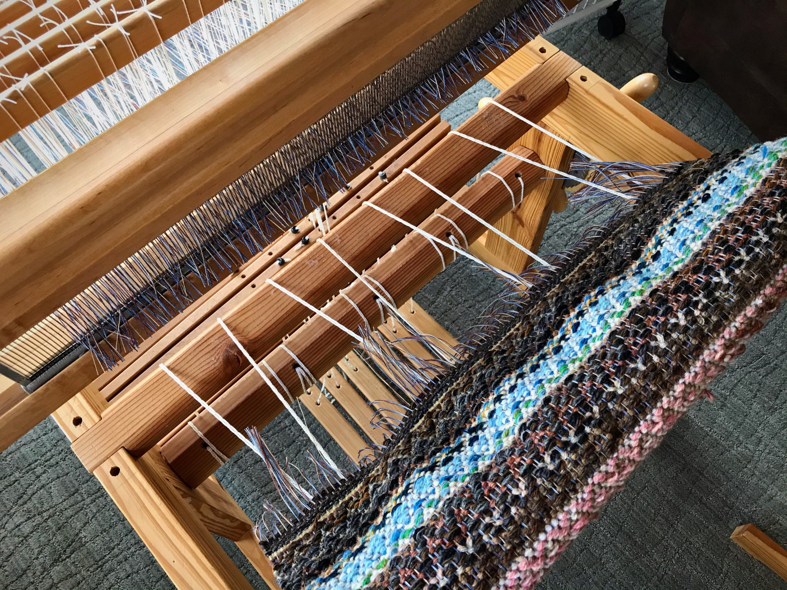 Cutting off beautiful linen and wool rosepath!