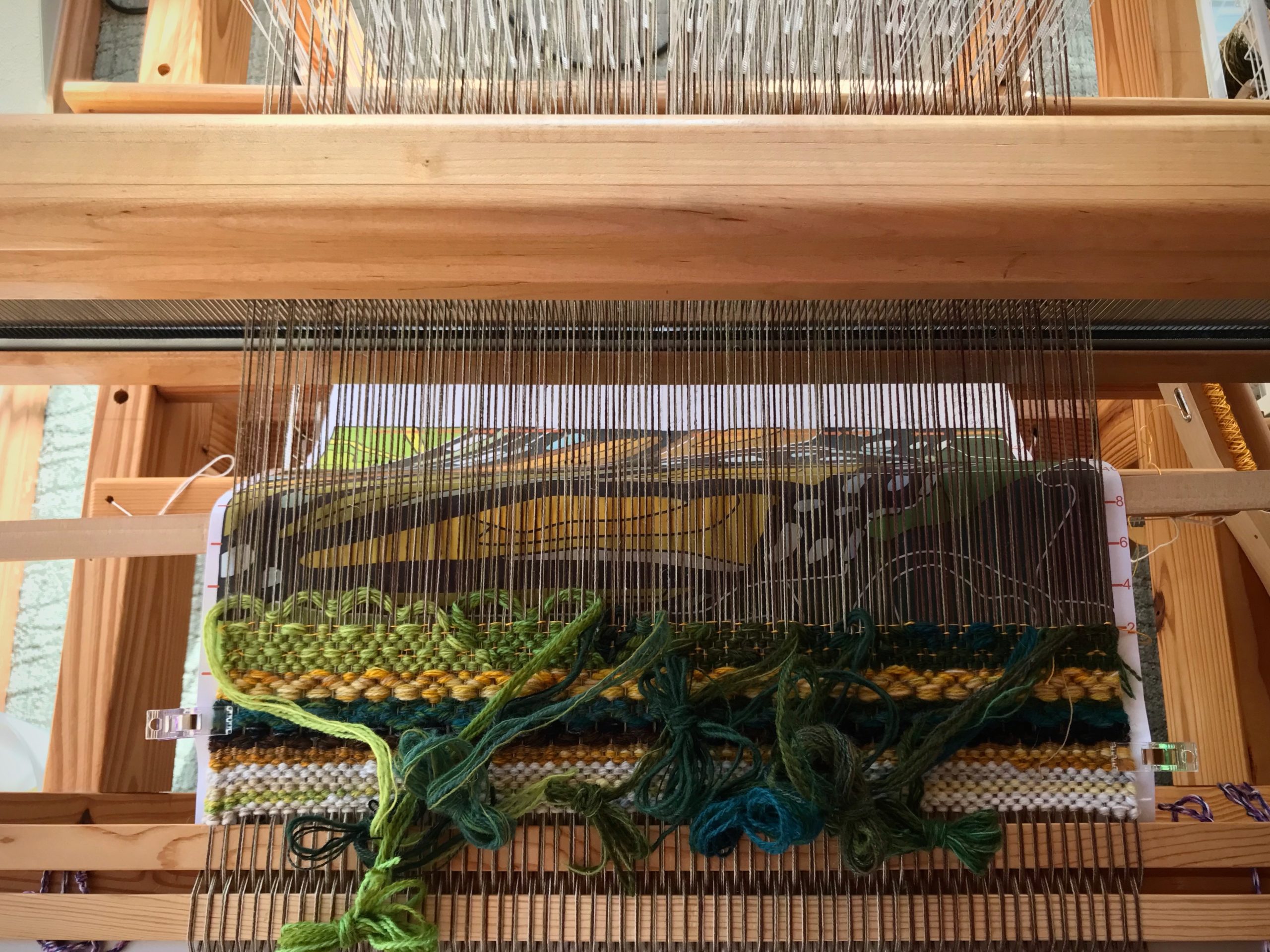 You can see the tapestry cartoon under the warp.