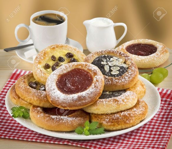 5030603-moravian-poppyseed-curd-and-jam-cakes-and-a-cup-of-coffee-stock-photo