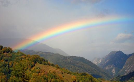 rainbow-stretching-hilly-forest-mountains-638x0_q80_crop-smart