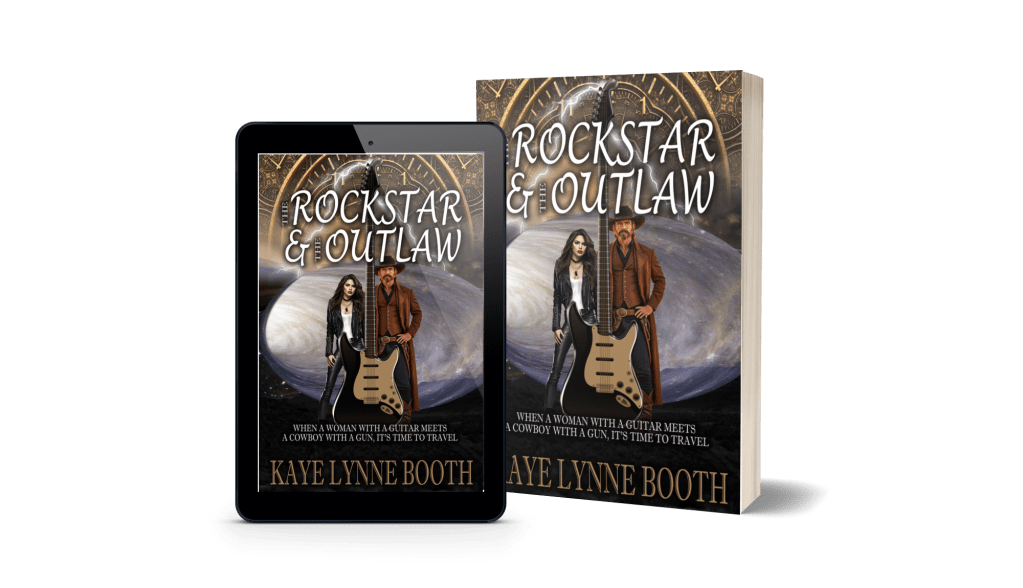Digital and Print Copies of The Rock Star & The Outlaw Book Cover: Sundial and planet in the background. Black leather clad woman and Man dressed in western garbstand beind giant electric guitar in foreground. Text: The Rock Star & The Outlaw, When a women with a guitar meets a cowboy with a gun, it's time to travel, Kaye Lynne Booth