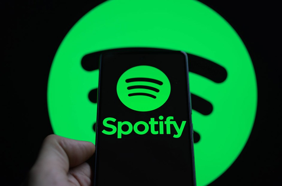 The Spotify logo is being displayed on a smartphone with the Spotify icon visible in the background in this photo illustration on Feb. 11, 2024 in Brussels, Belgium.