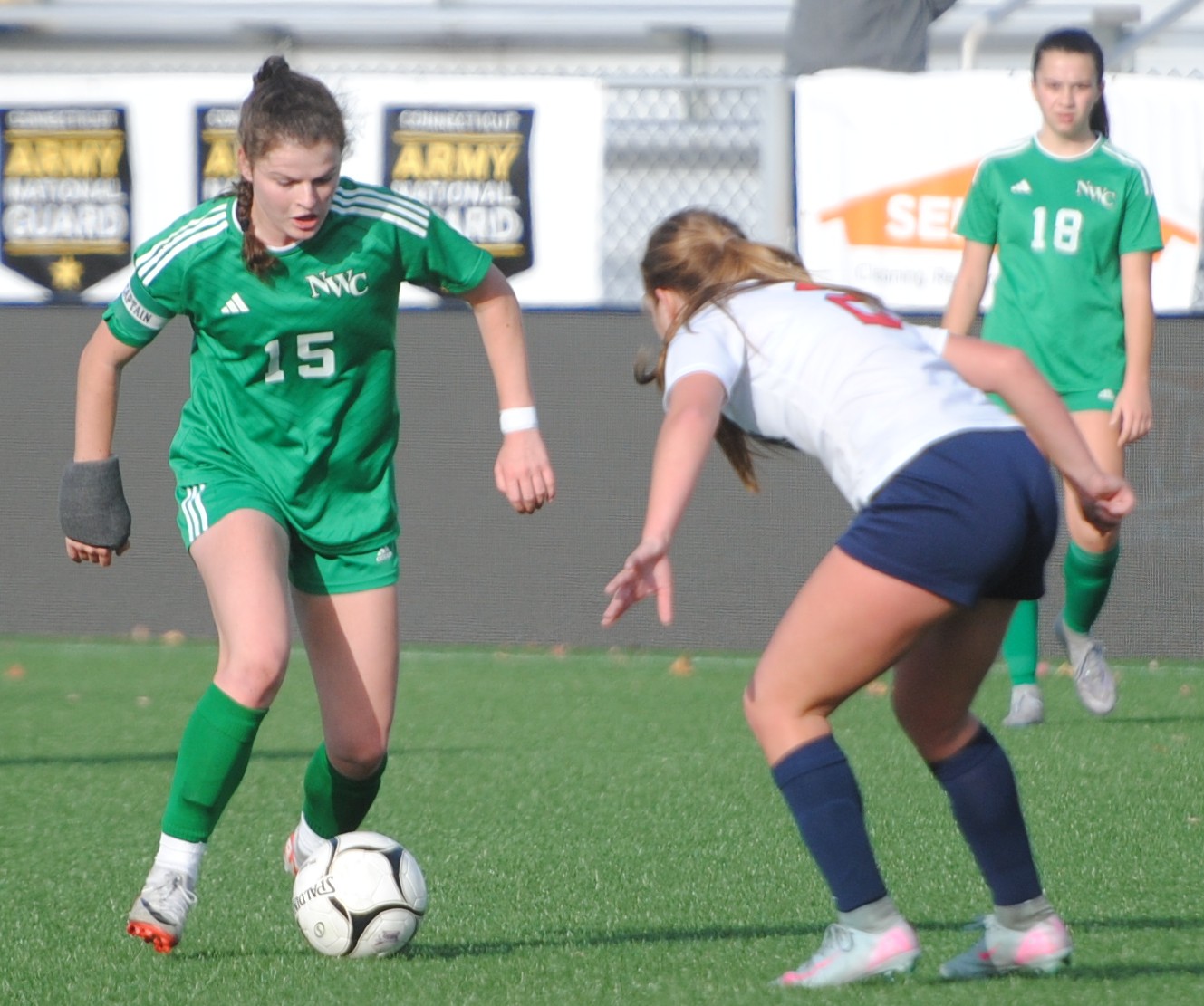 NWCgirlssoccer2 Northwest Catholic's Maeve Staunton (15) takes on Foran's Peighton Nash (2) in the Class M girls soccer championship game at Trinity Health Stadium in Hartford. Foran beat Northwest Catholic 3-2 for the title last fall. (Photo by Lori Riley)