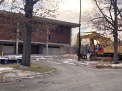 IMG_8417 Heavy equipment is in place to demolish a former classroom building at the old UConn campus in West Hartford, where a developer plans a massive mixed-use project. (Don Stacom/The Hartford Courant)