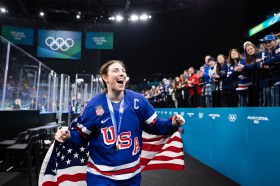 Ice Hockey - Milano Cortina 2026 Winter Olympics: Day 13 Team USA captain Hilary Knight celebrates with fans after Thursday's gold medal ceremony at Milano Santagiulia Ice Hockey Arena. Knight scored the game-tying goal to force overtime in a 2-1 U.S. win over Canada. (Andreas Rentz/Getty Images)