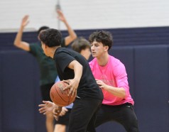 WTBB1 Windham Tech's Brady Marsh (pink shirt) plays defense at practice at Windham Tech in Willimantic Wednesday. Windham Tech will play in its first state championship game Saturday against Woodland in the Division IV final at Mohegan Sun. (Photo by Lori Riley)