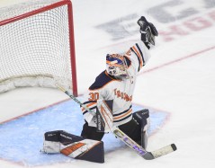 lymanhallgoalie Lyman Hall goalie Owen Hamm makes a save during the Division II state championship ice hockey game Friday night at M&T Bank Arena in Hamden. Lyman Hall beat Conard 5-2 to win the title. (Photo by Lori Riley)