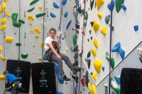 202606110815MCT_____PHOTO____US-NEWS-HEALTH-MAHA-AUTISM-TREATMENTS-FILEPIC-4-KHN-1 Noah Simmons glides down the rope at a climbing center in Gaithersburg, Maryland.