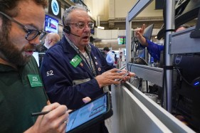 AP26177527495152 Serge Marinovich and Phil Phil Fracassini work on the floor of the New York Stock Exchange.