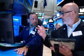 AP26187536980374 Michael Pistillo and Federico DeMarco work on the floor at the New York Stock Exchange.