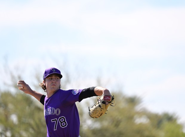 Colorado Rockies pitcher Chase Dollander (78) throws at Salt River...