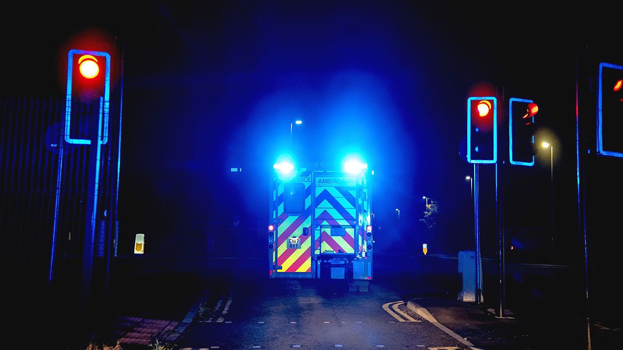 Blue lights flashing on an ambulance