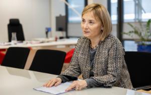 Gelsomina Vigliotti, Vice-President of the European Investment Bank (EIB), seating at a desk