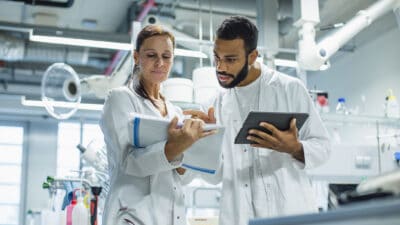 Scientists working in the laboratory and examining results.