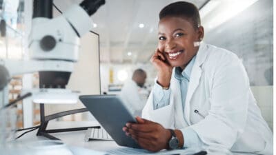 Shot of a young scientist using a digital tablet while working in a lab.