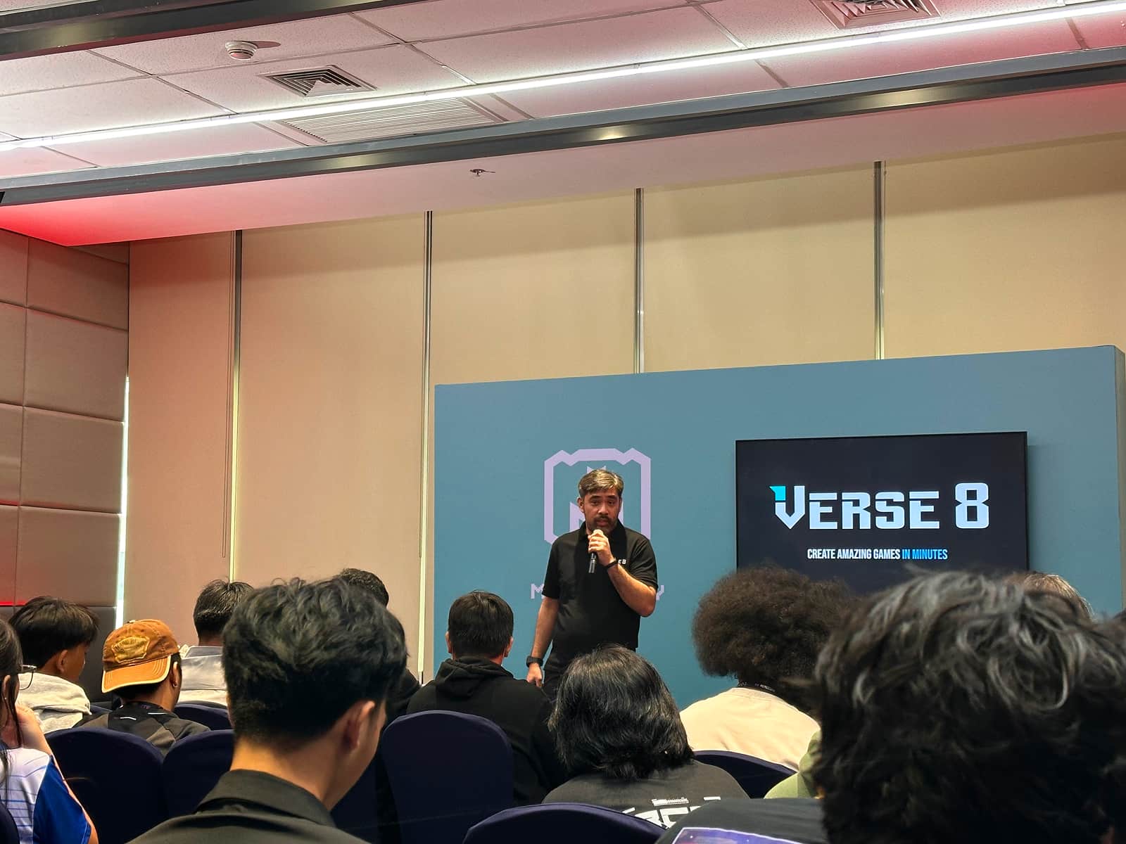 Speaker presenting Verse8 game creation tool