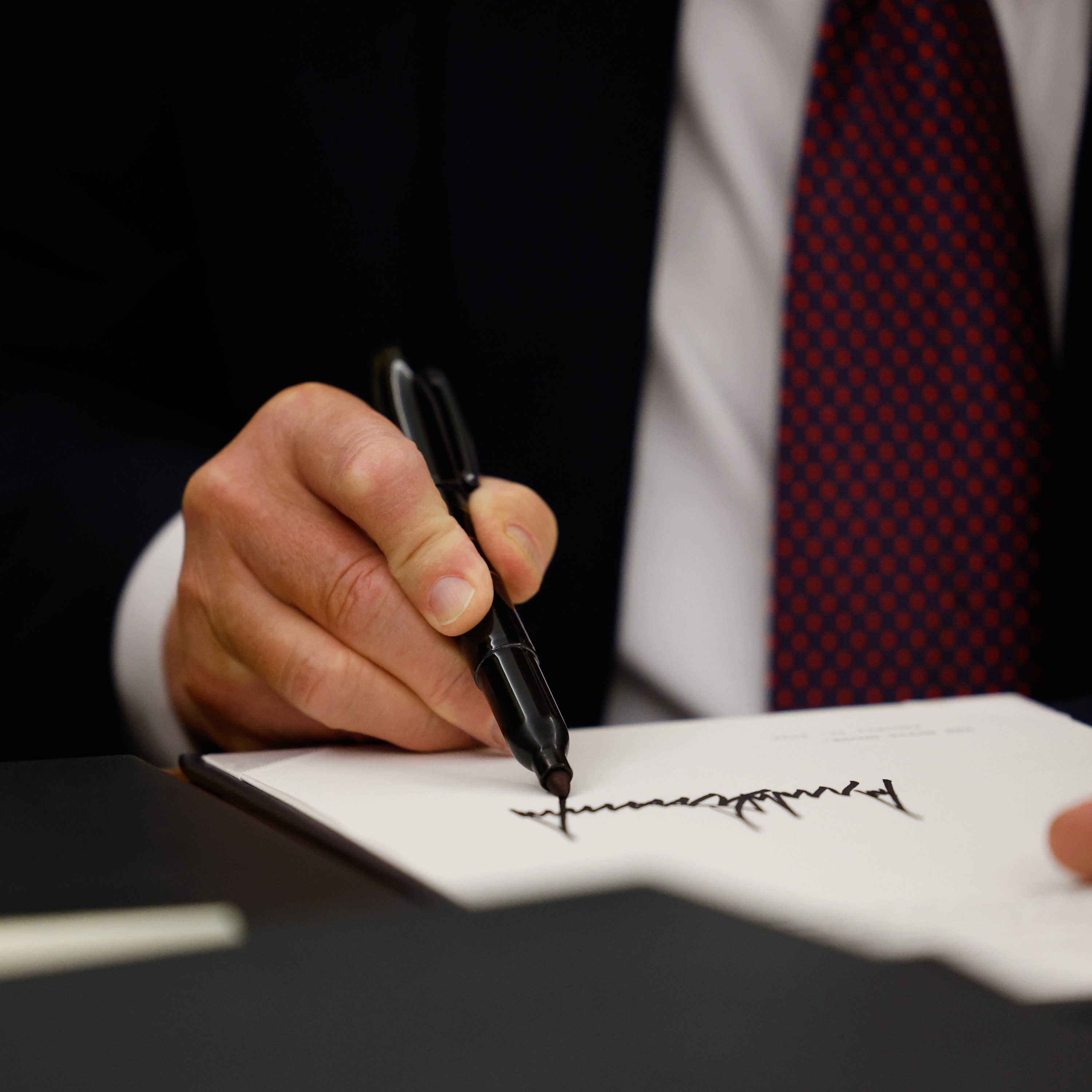 President Donald Trump signs executive orders in the Oval Office