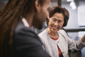 A man and woman smiling