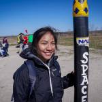 Stephanie Yazzie, Northern Arizona University student and NAU Space Jacks team member, poses with her team’s rocket in this photo from the 2019 NASA First Nations Launch (FNL) competition.