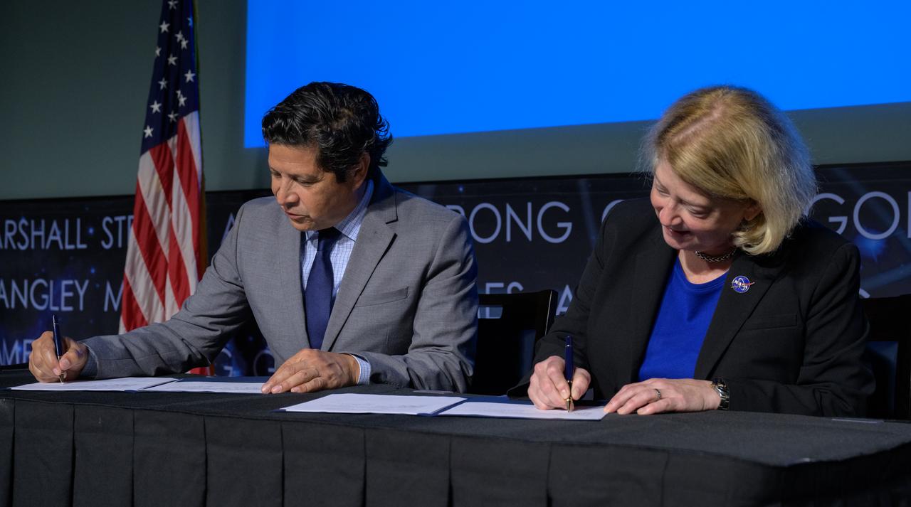 President and CEO of the Hispanic Heritage Foundation Jose Antonio Tijerino, left, and NASA Deputy Administrator Pam Melroy, sign a Space Act Agreement between the HHF and NASA to collaborate and expand STEM opportunities for Latino K-12 and university students and reduce barriers to agency activities and opportunities, Monday, Sept. 30, 2024, at the NASA Headquarters Mary W. Jackson Building in Washington.