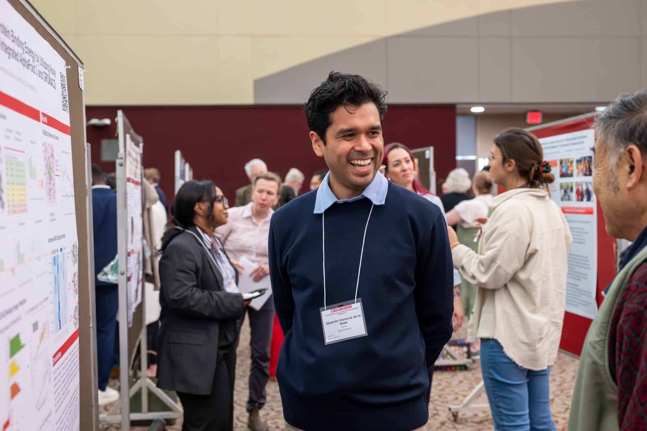 Students discuss their research with the public and faculty judges.
