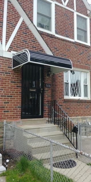 Philadelphia's Custom Awning & Canopy Specialists 11 Phoenix Awning Company's awning services providing a black metal door canopy