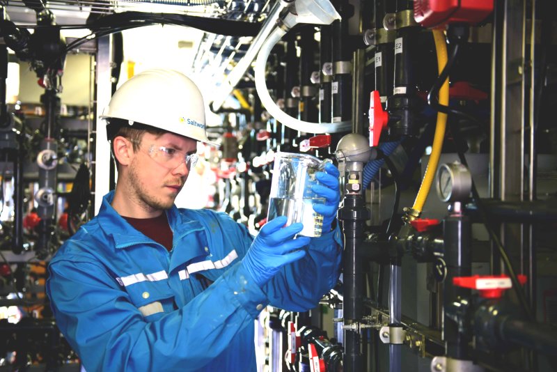 Photo of a Saltworks engineer analyzing a water sample at a treatment plant