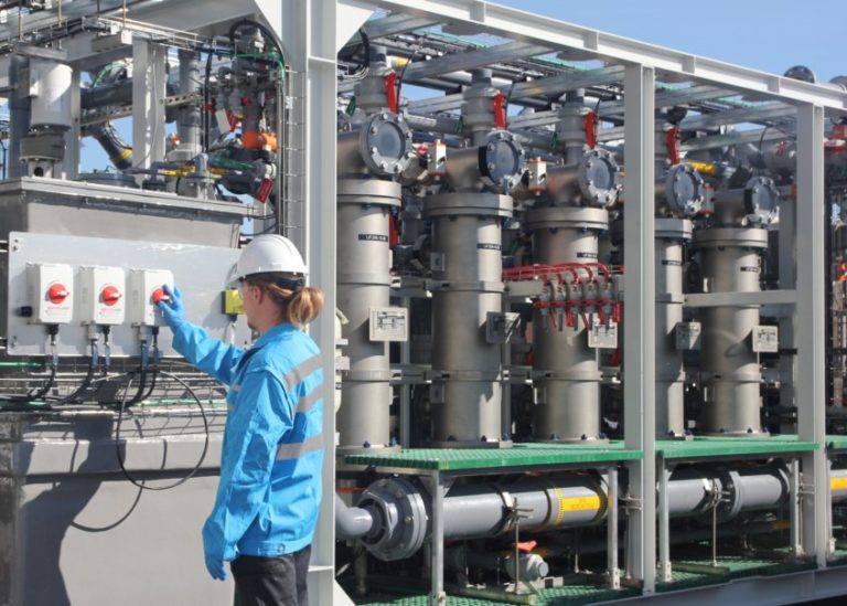 Photo of a Saltworks XtremeUF system, outdoors with a technician during testing