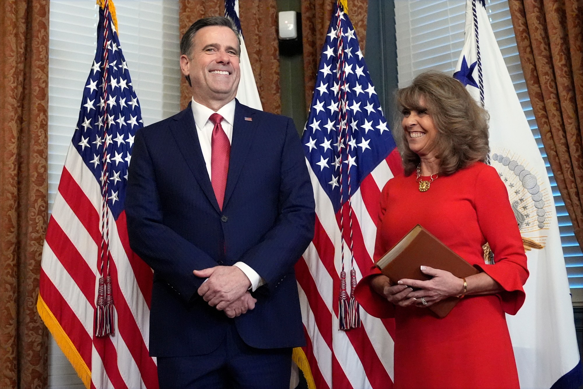 John Ratcliffe and his wife Michele smile as Vice President JD Vance speaks before he is sworn in as CIA Director in the Vice Presidential ceremonial office in the Eisenhower Executive Office Building on the White House campus, Thursday, Jan. 23, 2025, in Washington. (AP Photo/Alex Brandon)