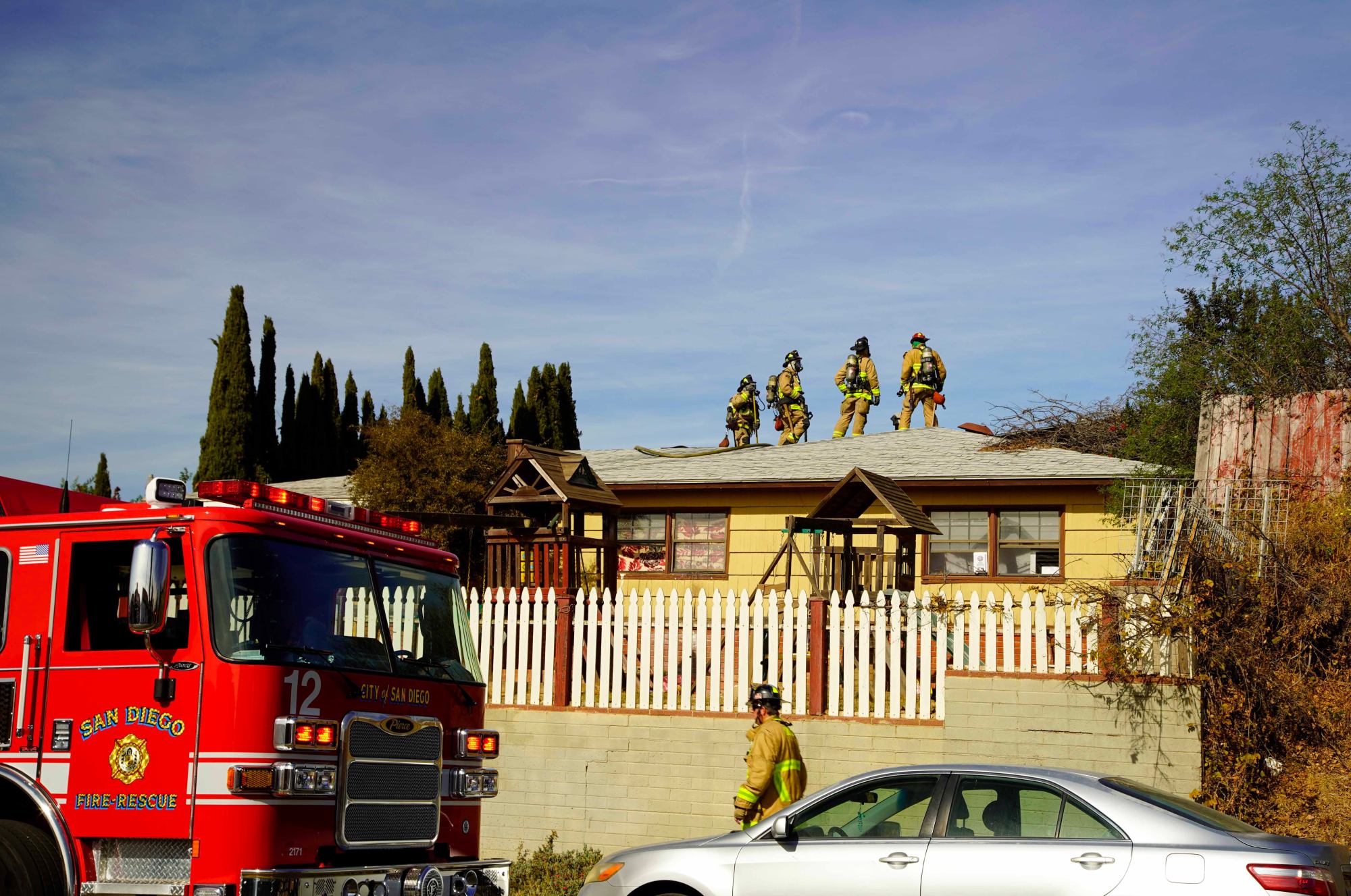 Firefighters combat a fire on Churchyard St. in Valencia Park on Tuesday, Jan. 21, 2025 in San Diego, California. (Alejandro Tamayo / The San Diego Union-Tribune)