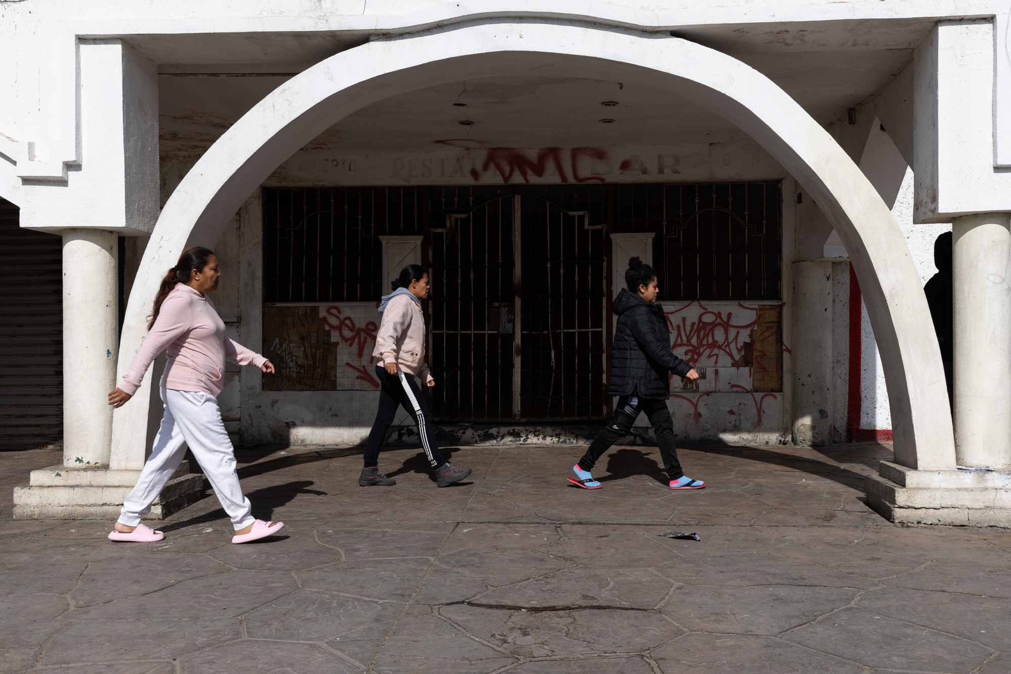 A group of migrants staying at Juventud 2000 shelter head to Pedwest Port of Entry to try to understand what is happening after receiving news that their CBP One appointments were cancelled on Monday, Jan. 20, 2025 in Tijuana, Mexico. (Ana Ramirez / The San Diego Union-Tribune)