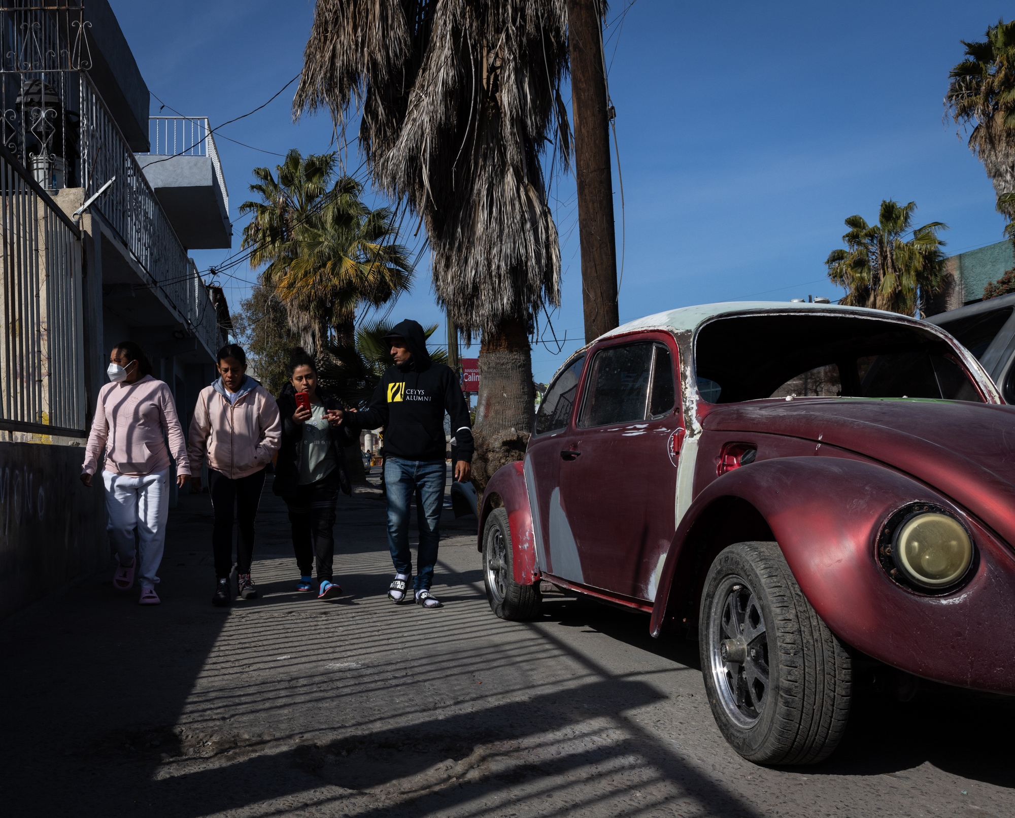 A group of migrants staying at Juventud 2000 shelter head to Pedwest Port of Entry to try to understand what is happening after receiving news that their CBP One appointments were cancelled on Monday, Jan. 20, 2025 in Tijuana, Mexico. (Ana Ramirez / The San Diego Union-Tribune)