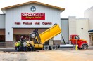 RAS-L-RAMONASTATION Construction crews began laying new pavement along the storefronts at Ramona Station on May 15, as renovation work continues at the former Kmart shopping center. (Stephanie Ogilvie)