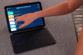 Screen_Time_69555-1 LuAnn Oliver's son demonstrates how he uses an iPad for his classes.