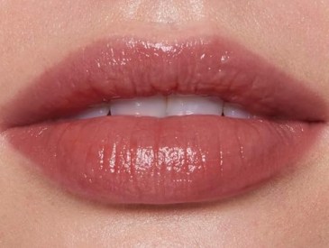 closeup of woman wearing e.l.f. O Face Satin Lipstick in Dirty Talk