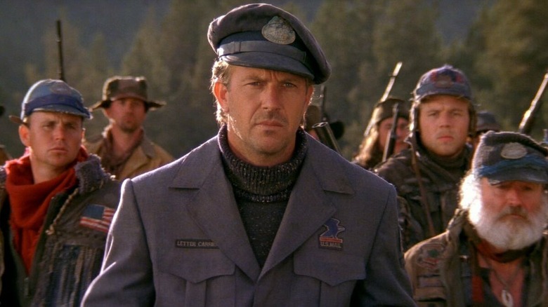 Kevin Costner as the Postman, leading an army of postmen, in The Postman