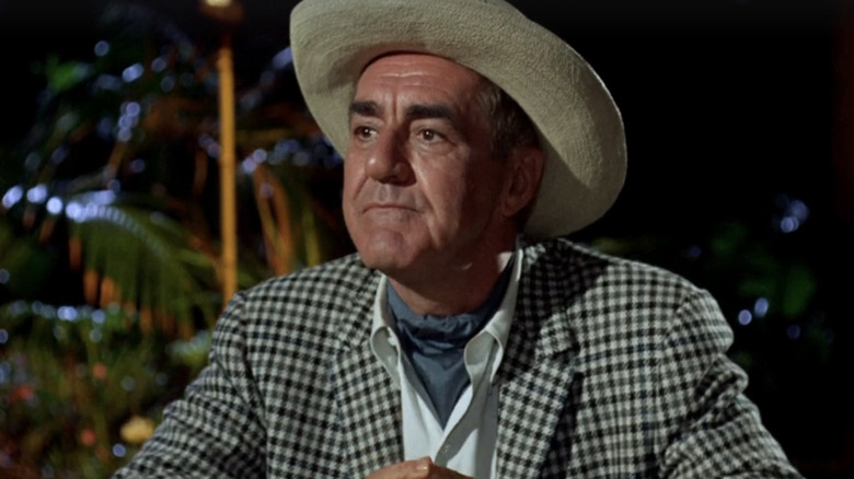 Jim Backus' Thurston Howell III stands looking off into the distance in Gilligan's Island