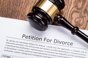GettyImages-854089448 Wooden Gavel On Petition For Divorce Paper At Wooden Desk In Courtroom