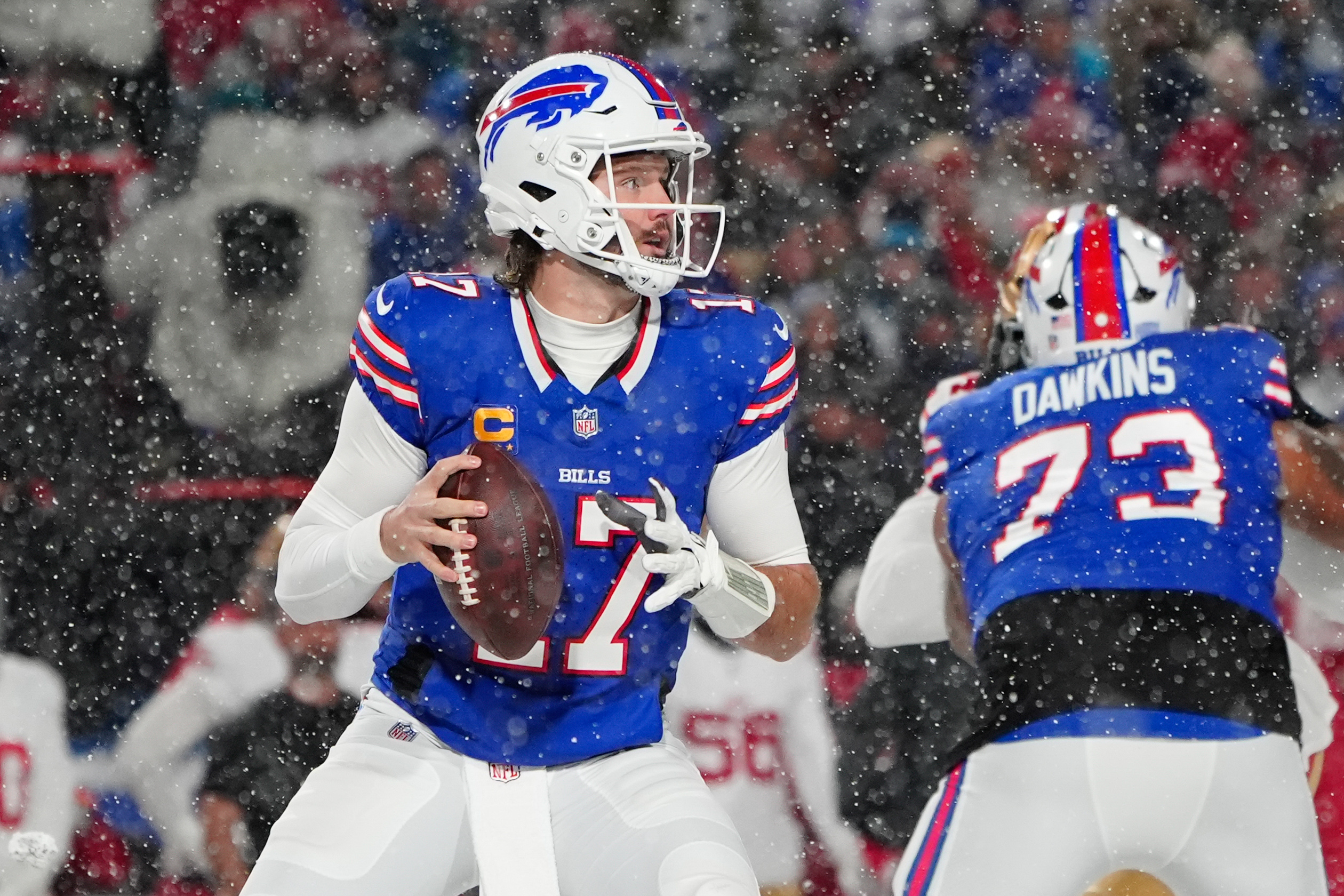 Buffalo Bills quarterback Josh Allen (17) looks to throw the ball against the San Francisco 49ers during the first half at Highmark Stadium.