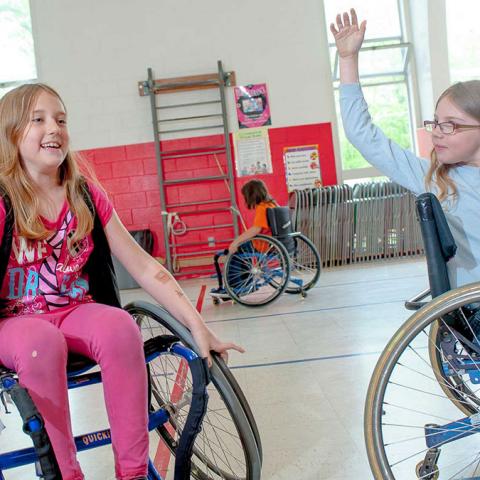 Girls in wheelchairs