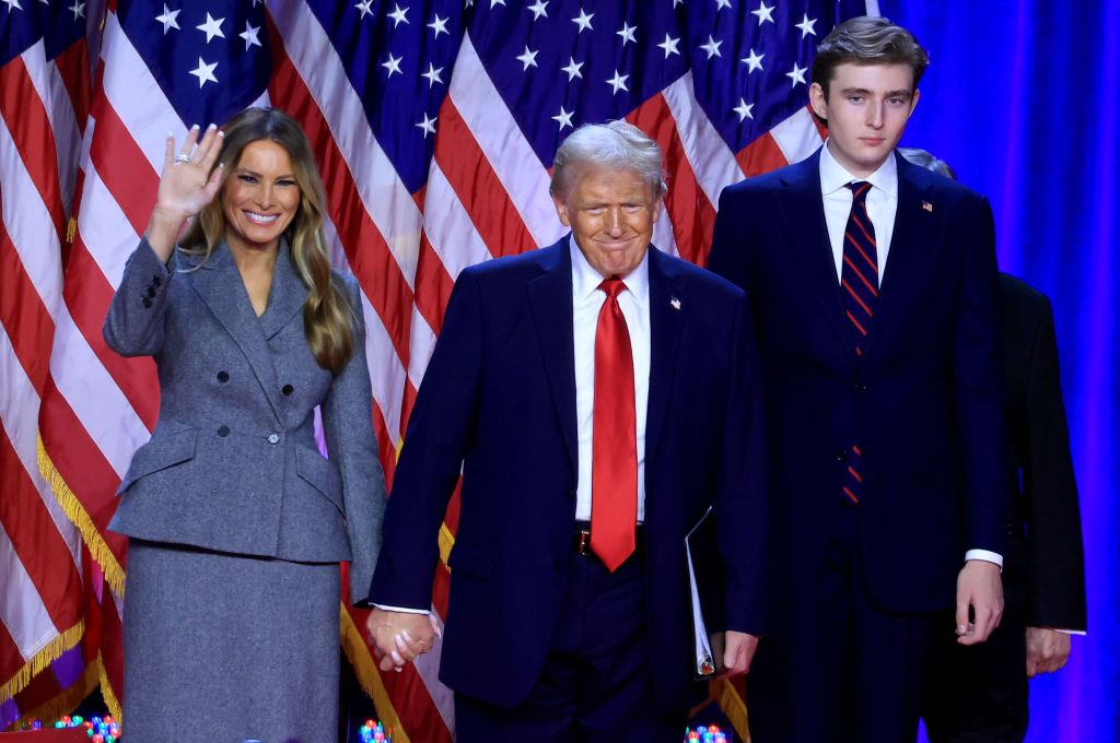 Donald Trump, his wife Melania, and 18-year-old son Barron, who is six feet seven inches tall, address crowds in Florida on their victorious election night.